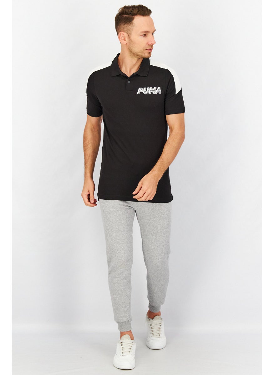 PUMA Men Spread Neckline Short Sleeve Graphic Logo Polo Shirt, Black  - Image 4