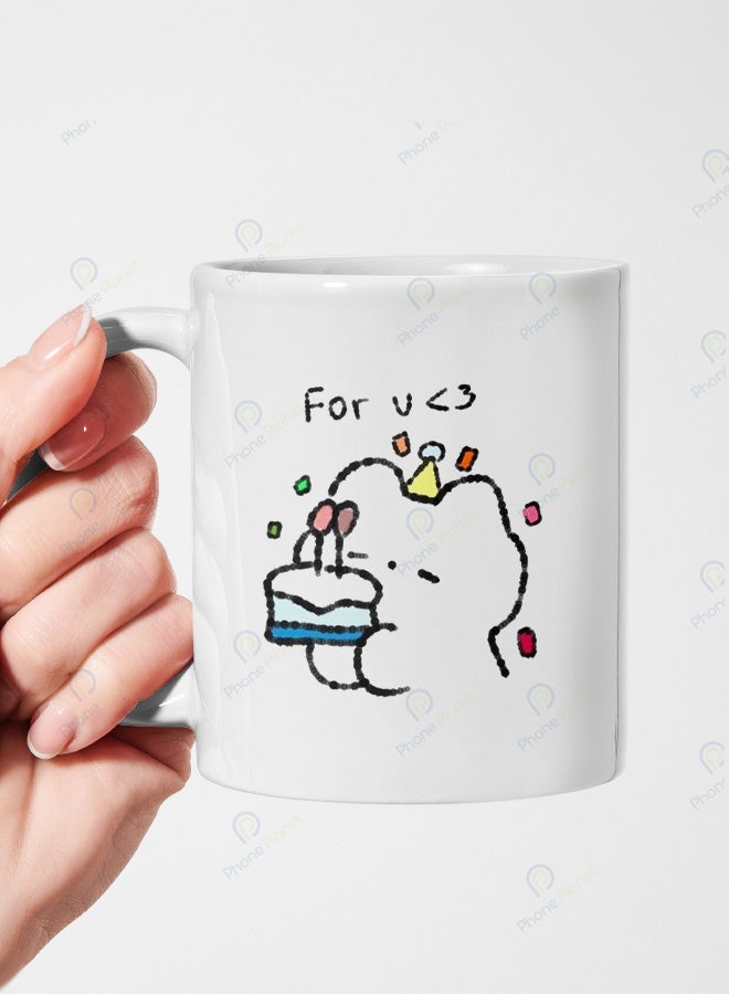 A ceramic mug printed with the phrase For you in a cake design featuring a comfortable handle