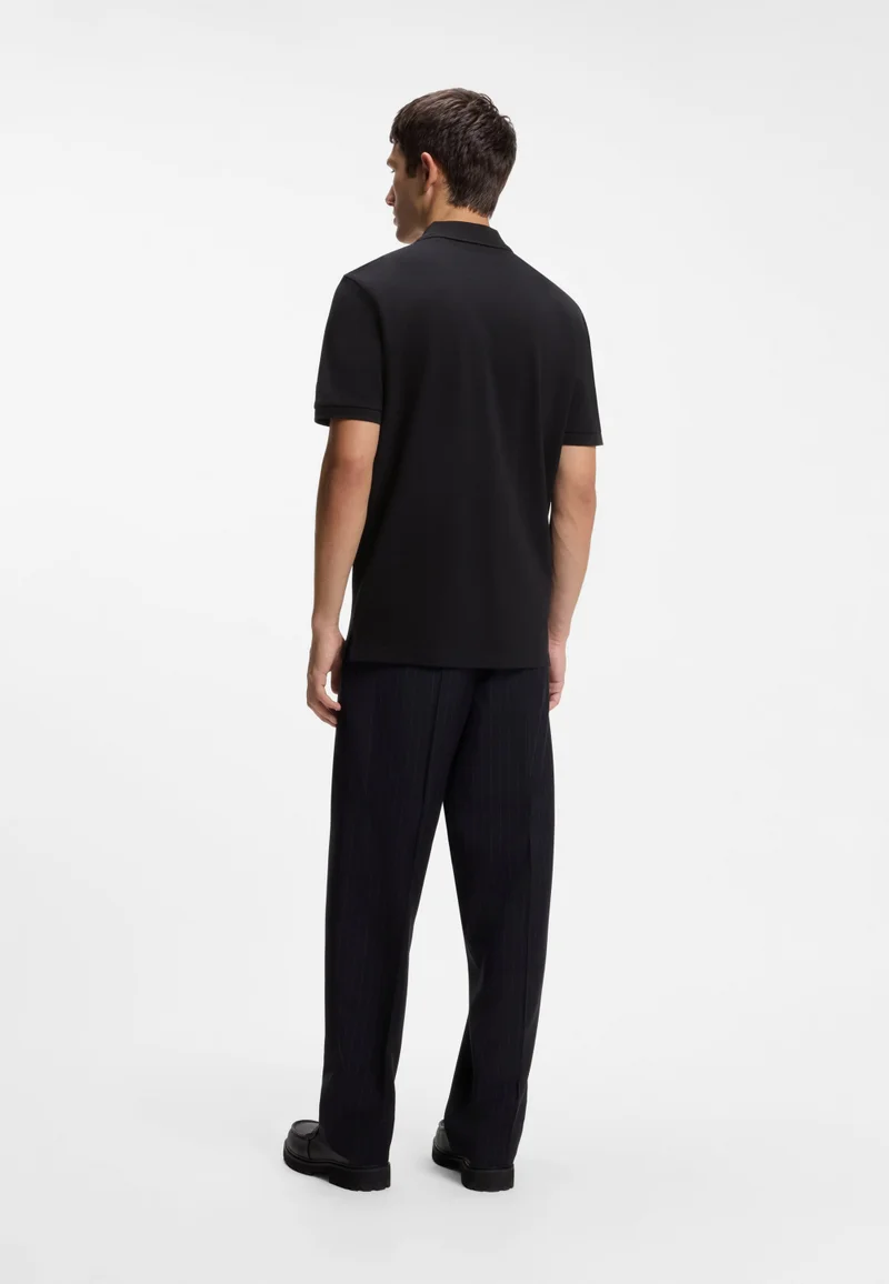 HUGO Black Polo shirt in cotton piqué with logo detail for Men | Best Price UAE