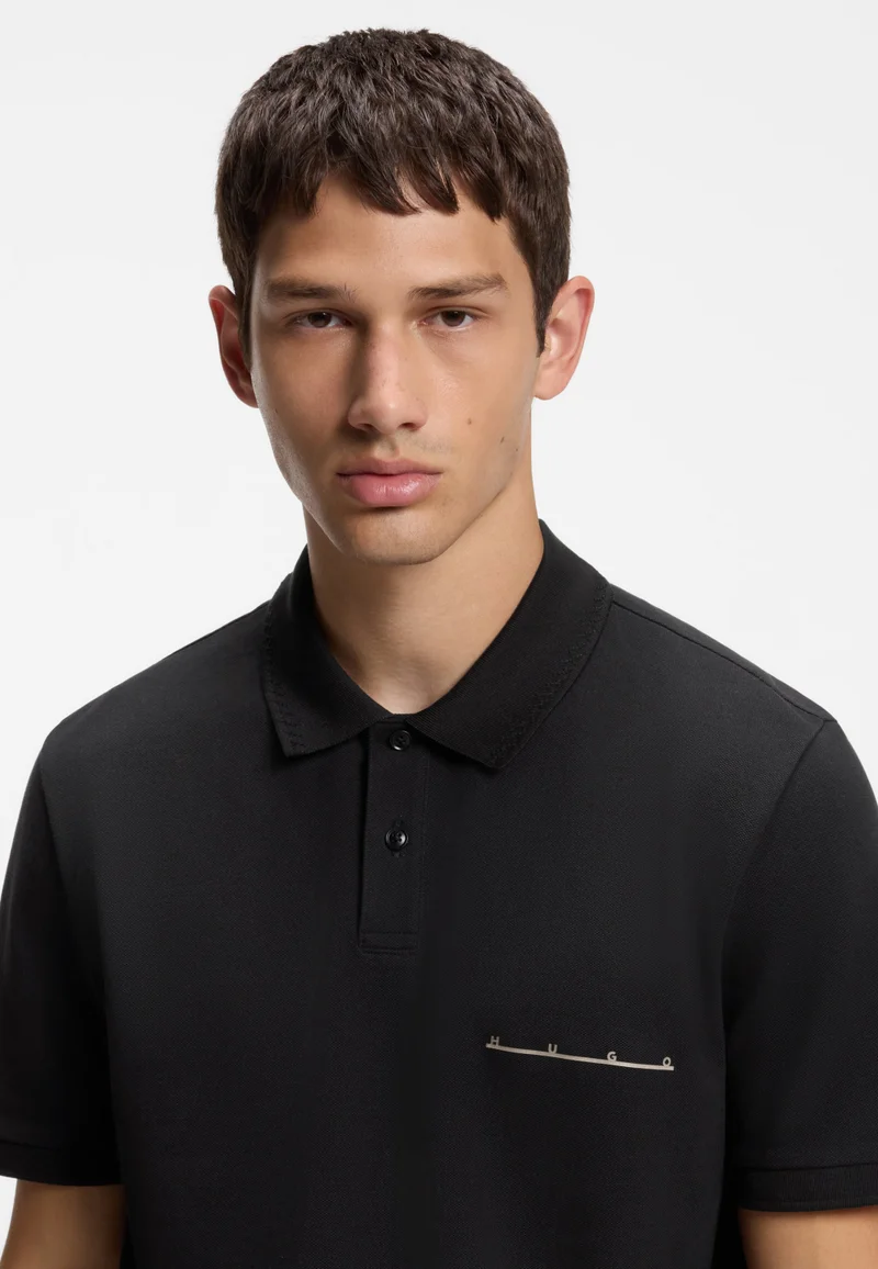 HUGO Black Polo shirt in cotton piqué with logo detail for Men | Best Price UAE