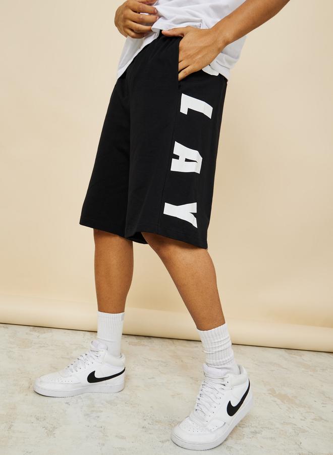 Styli Oversized Terry Shorts with Bold Text Print Detail - Image 1