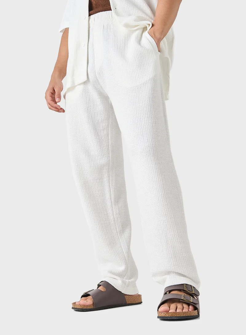 ايكونيك Iconic Regular Fit Textured Trousers with Pockets
