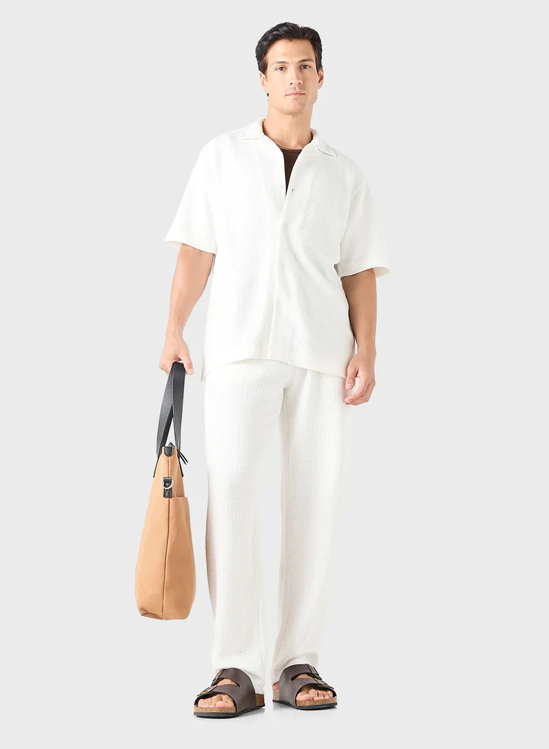 ايكونيك Iconic Regular Fit Textured Trousers with Pockets