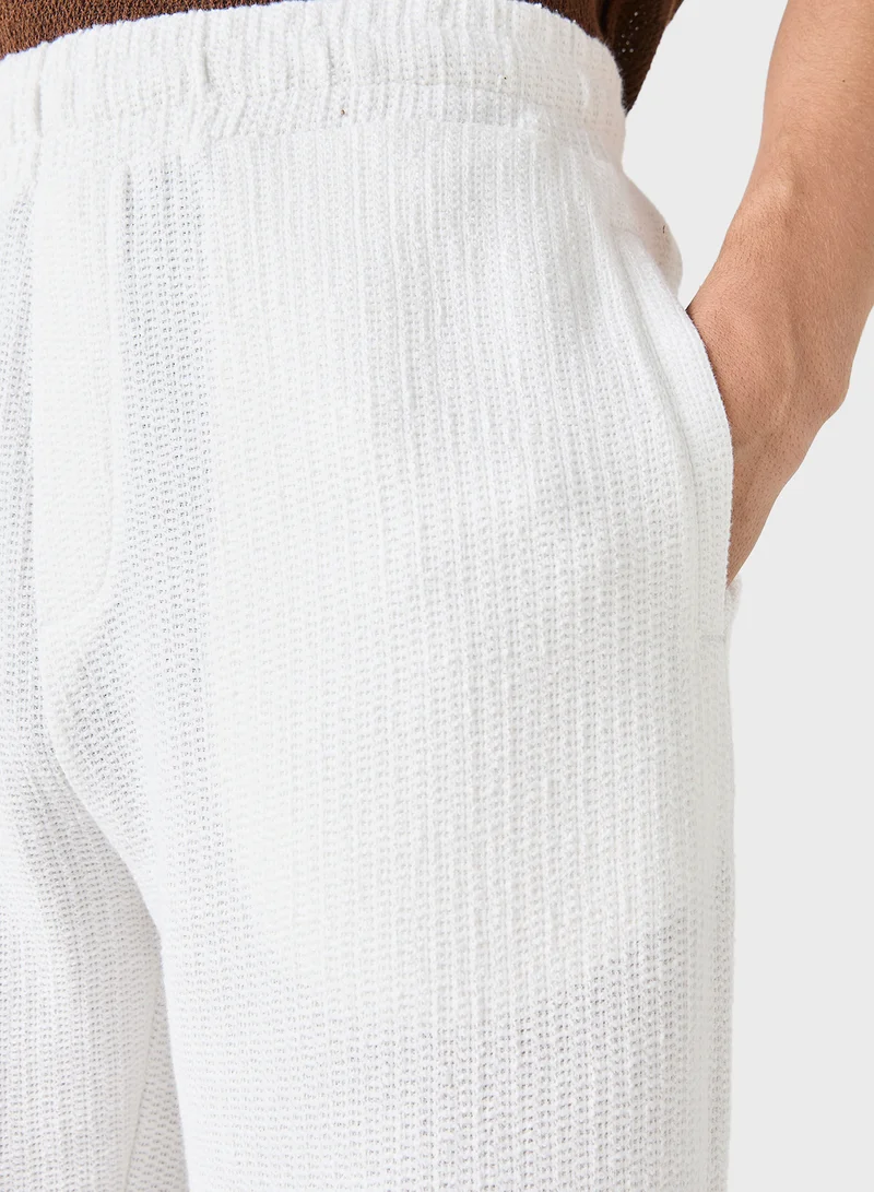 ايكونيك Iconic Regular Fit Textured Trousers with Pockets