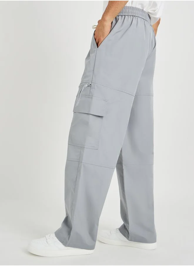 ستايلي Styli Men Grey Solid Oversized Open Hem Cargo Joggers with Zipper Pockets