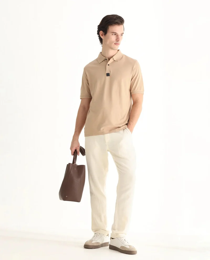 Rare Rabbit Men's Silicon Badge Branded Solid Polo