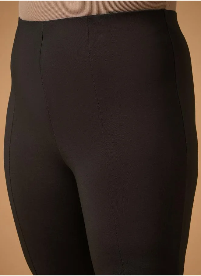 SASSAFRAS Plus Size Front Slit Detail Flared Pants by Styli