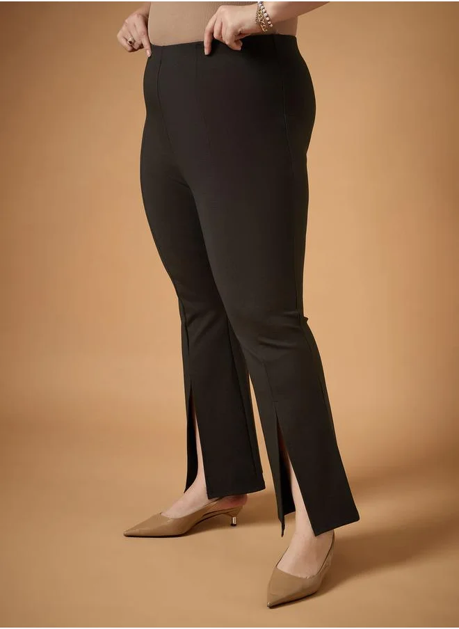 SASSAFRAS Plus Size Front Slit Detail Flared Pants by Styli