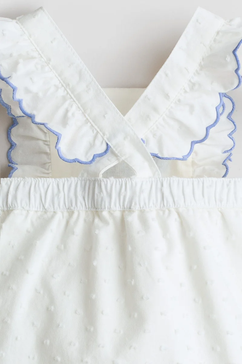 H&M Frill-trimmed cotton romper suit