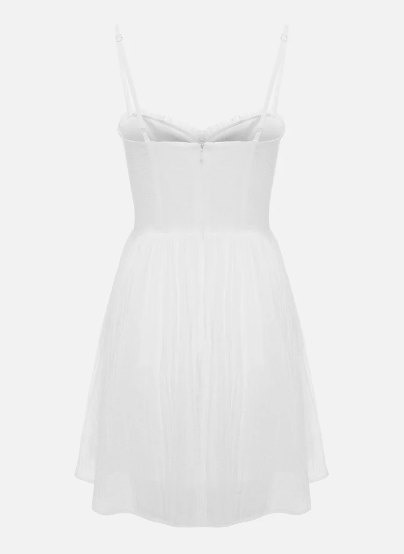 Lichi Mini strappy dress with lace ruffles on the bodice