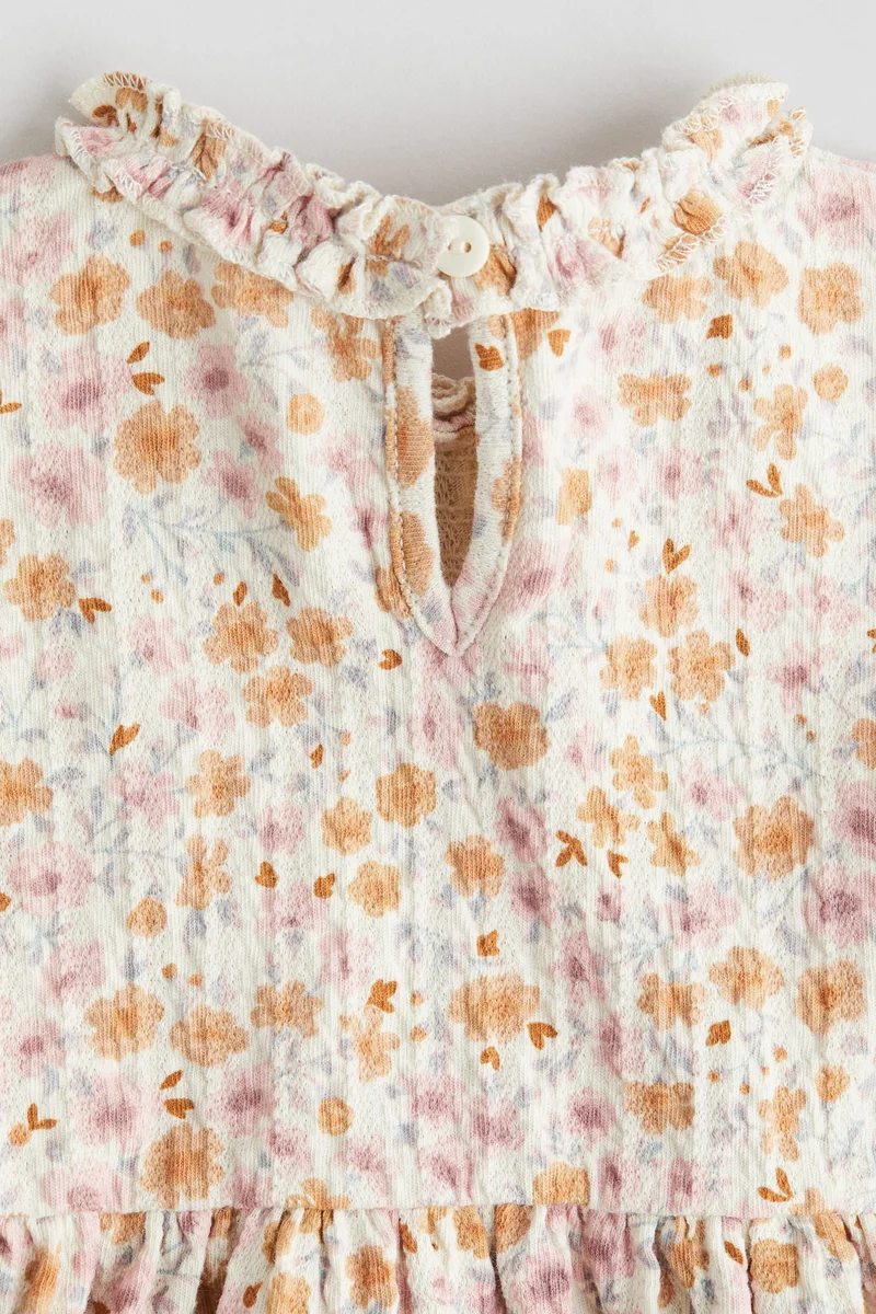 اتش اند ام فستان من جيرسيه الجاكار مزين بكشكشة