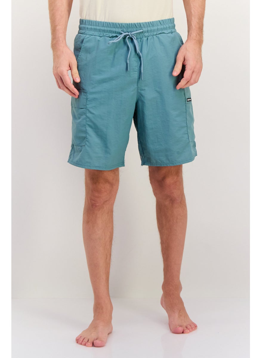 Men 8,5 Inseam Brand Logo Drawstring Swim Shorts, Slate Blue - pzsku/ZC3CC589160D100AB4DD7Z/45/_/1737642125/c8374129-0ca9-4f7d-bef3-6113a6a87f96