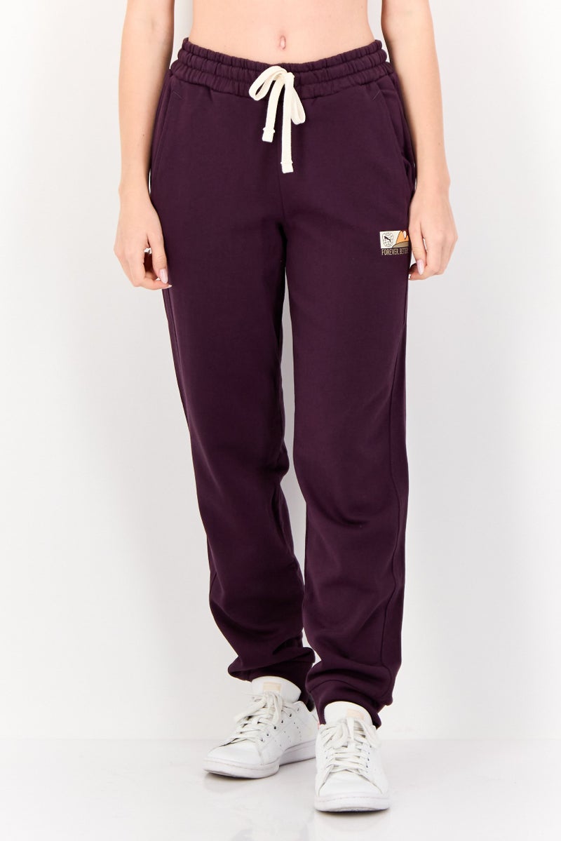 PUMA Women Sportswear Fit Outdoor Jogger Pants, Dark Purple - Image 1