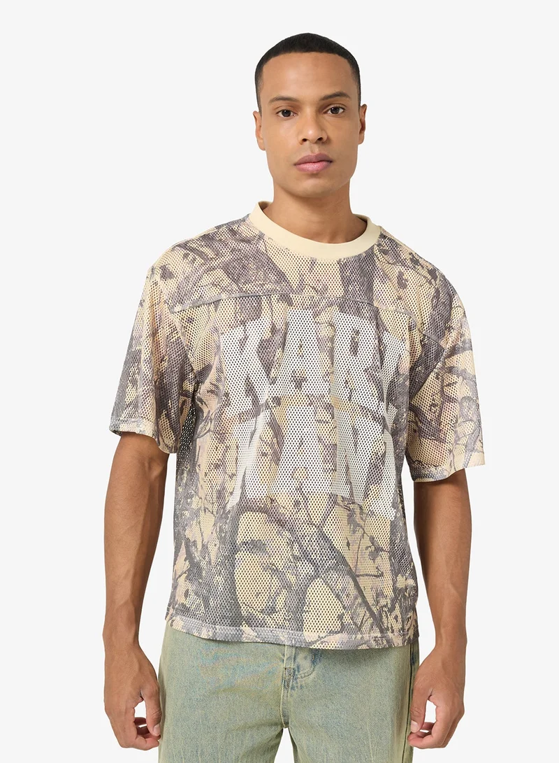 كارل كاني قميص جيرسي بوكسي شبكي بتصميم مموه تراثي خشبي