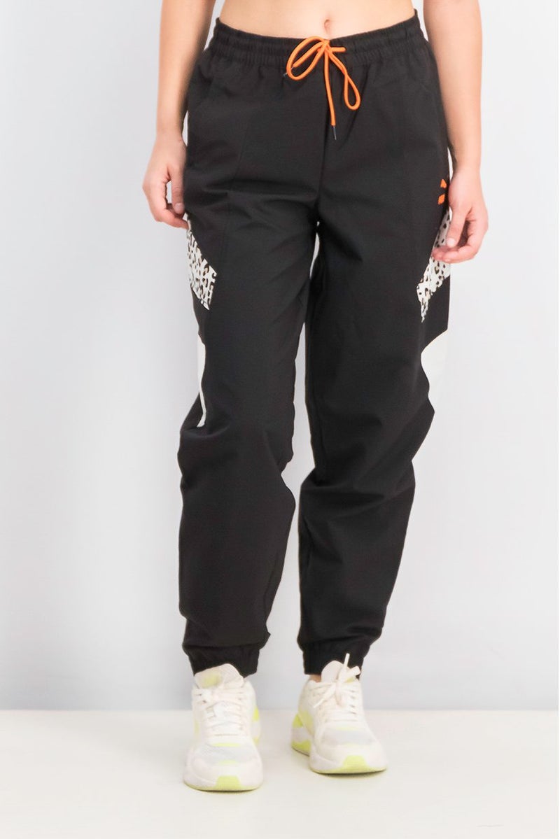 PUMA Women Sportswear Fit Brand Logo Outdoor TFS Track Pants, Black - Image 1