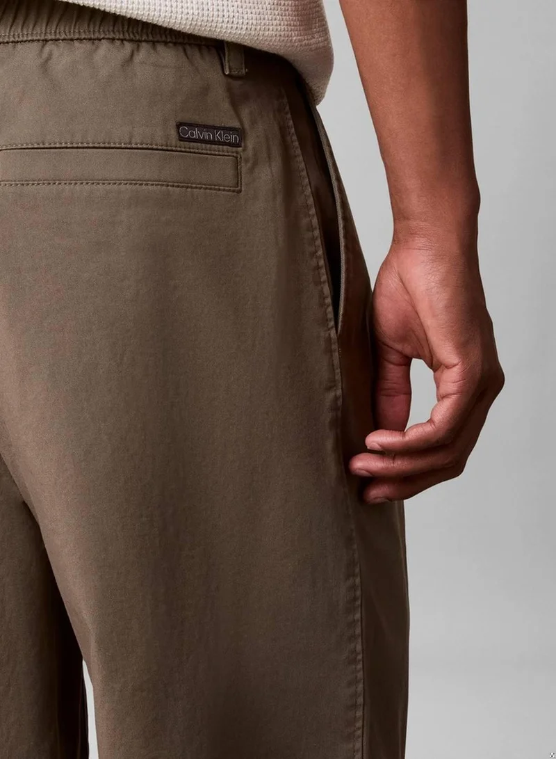 Calvin Klein Jeans Dusty Olive Comfort Cotton Relaxed Chino Trousers for Men | Best Price UAE