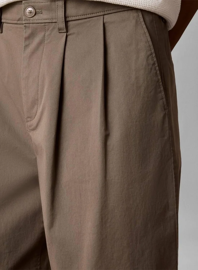 Calvin Klein Jeans Dusty Olive Comfort Cotton Relaxed Chino Trousers for Men | Best Price UAE