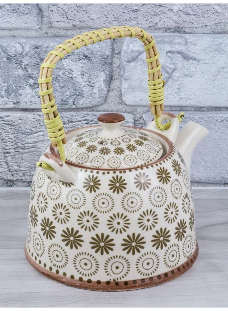 A simple and elegant porcelain teapot with a wicker handle, its size is convenient for serving tea or raw herbs. It also features a multi-shaped strainer for easy cleaning. - Image 2