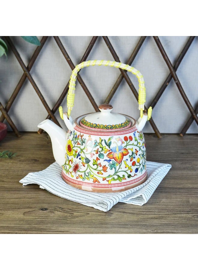 A simple and elegant porcelain teapot with a wicker handle, its size is convenient for serving tea or raw herbs. It also features a multi-shaped strainer for easy cleaning. - Image 1