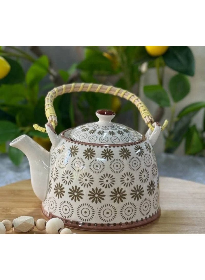 A simple and elegant porcelain teapot with a wicker handle, its size is convenient for serving tea or raw herbs. It also features a multi-shaped strainer for easy cleaning. - Image 4