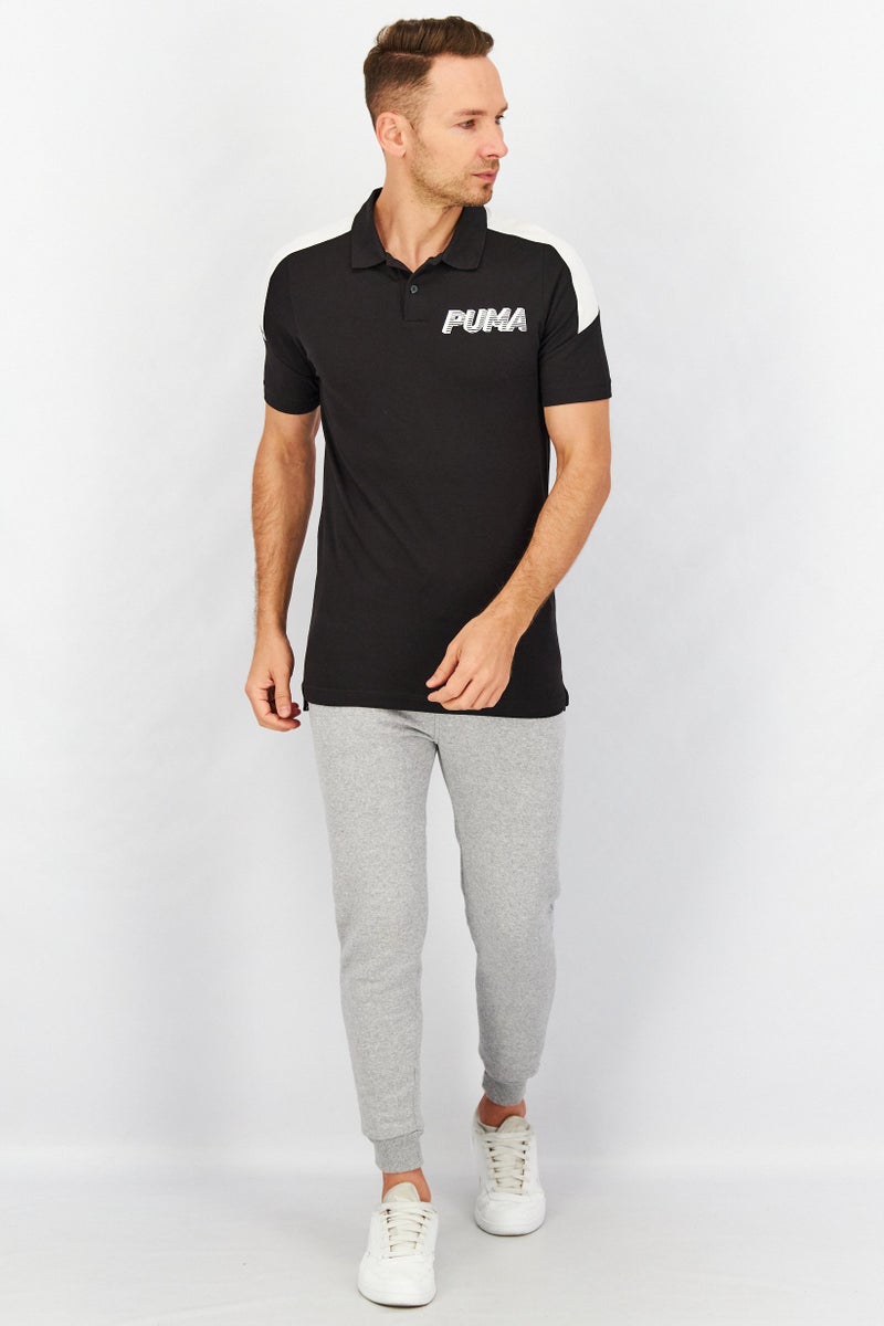 PUMA Men Spread Neckline Short Sleeve Graphic Logo Polo Shirt, Black - Image 4
