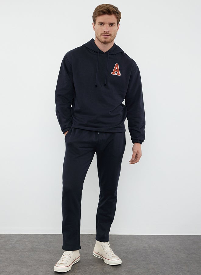 trendyol Black Oversize/Wide Cut Hooded Letter Embroidered Tracksuit TMNAW25EM00007 - Image 1