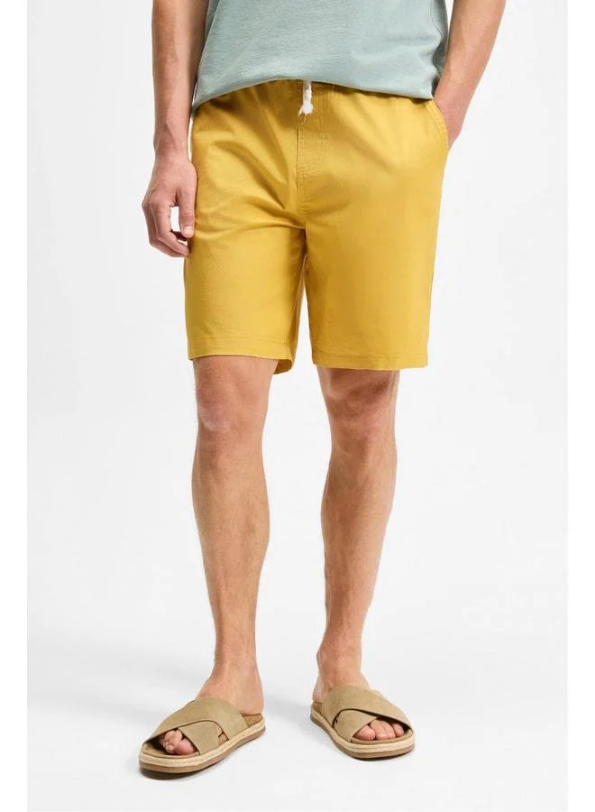 Grimelange LASPER Men's elastane Side Pocket Elastic Waist Relaxed Fit Saffron Yellow Shorts.