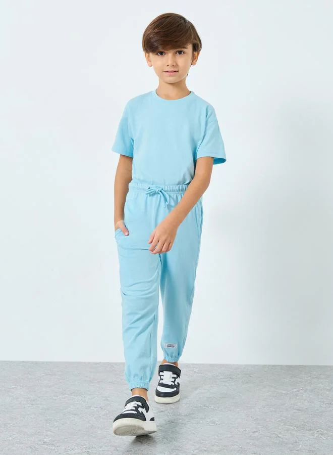 Styli Styli Boys Light Blue Solid T-Shirt and Joggers Set