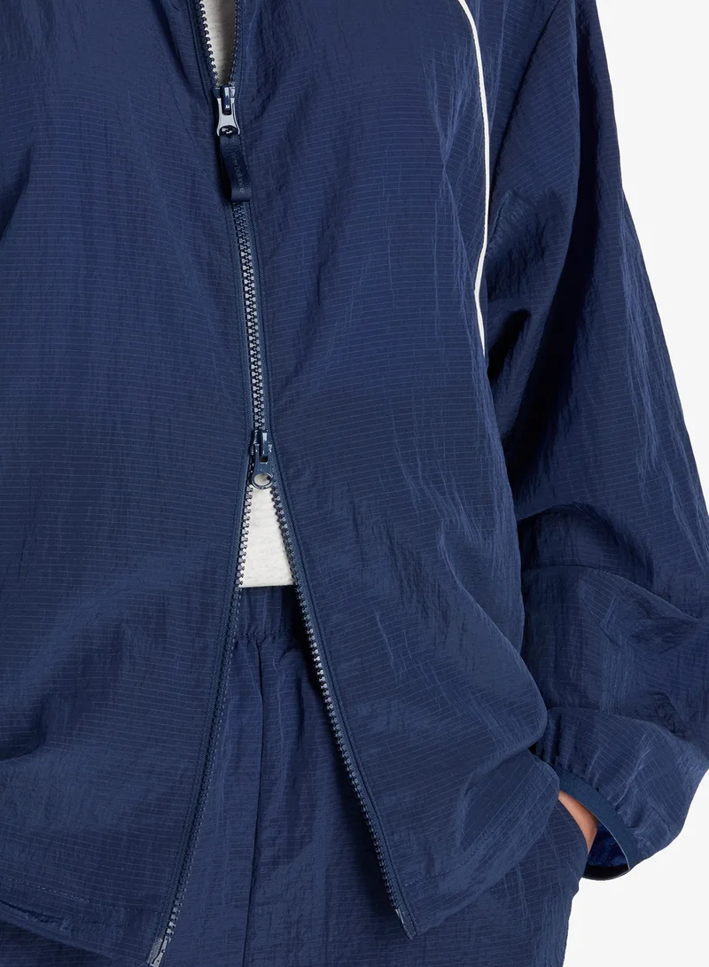 New Balance  Legacy Woven Jacket V1 for Women | Best Price UAE