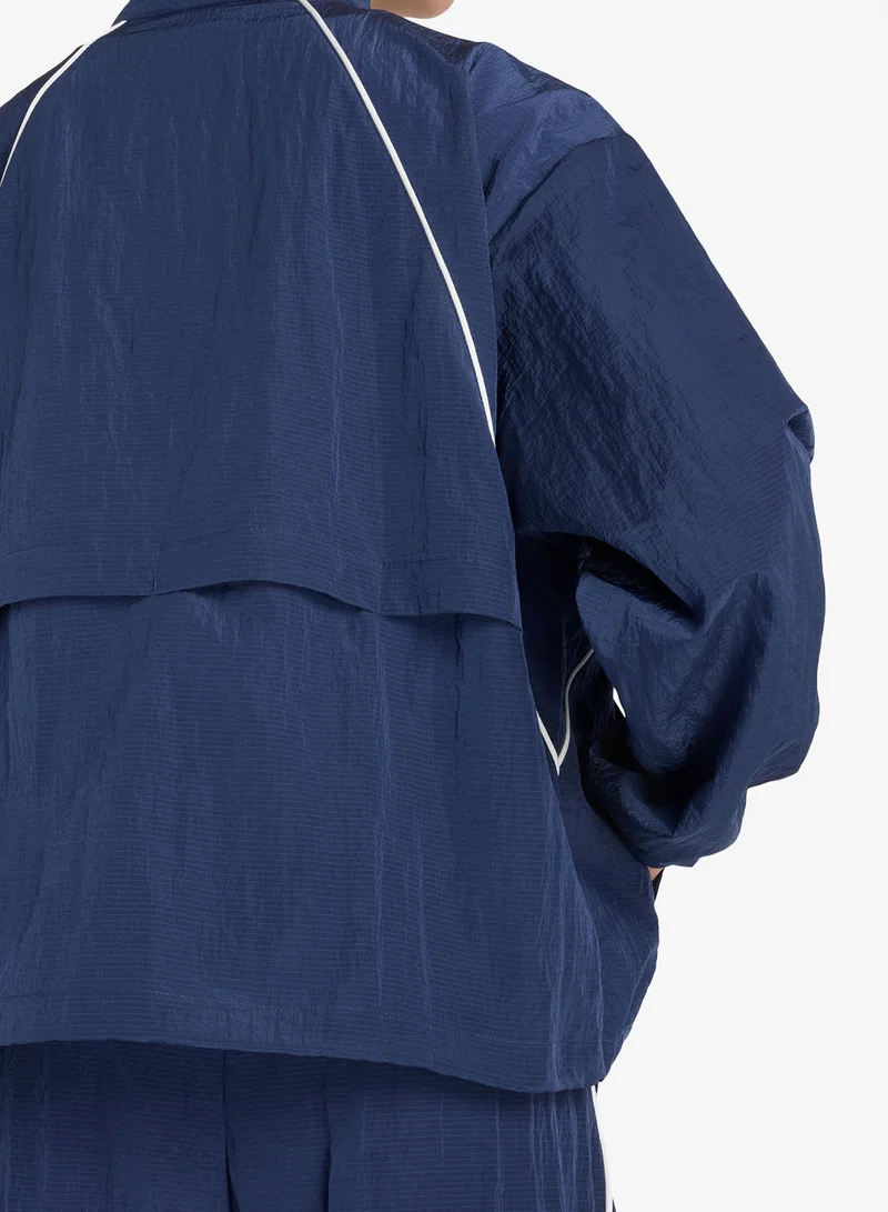 New Balance  Legacy Woven Jacket V1 for Women | Best Price UAE