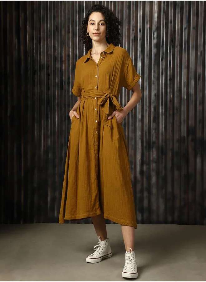 هاي ستار Women Dresses in Brown featuring Oversized fit with a solid pattern, spread collar collar, collar neckline, half sleeves, regular length, secured with button closure, crafted from cotton – a trendsetting piece that blends fashion and comfort.