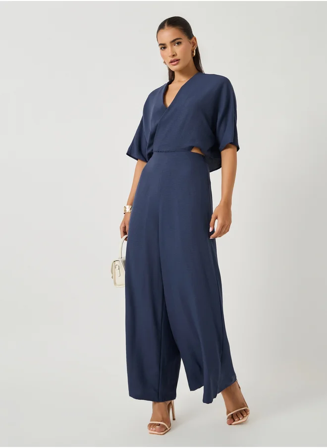ستايلي Solid Batwing Sleeves Wrap Look Wide Leg Jumpsuit