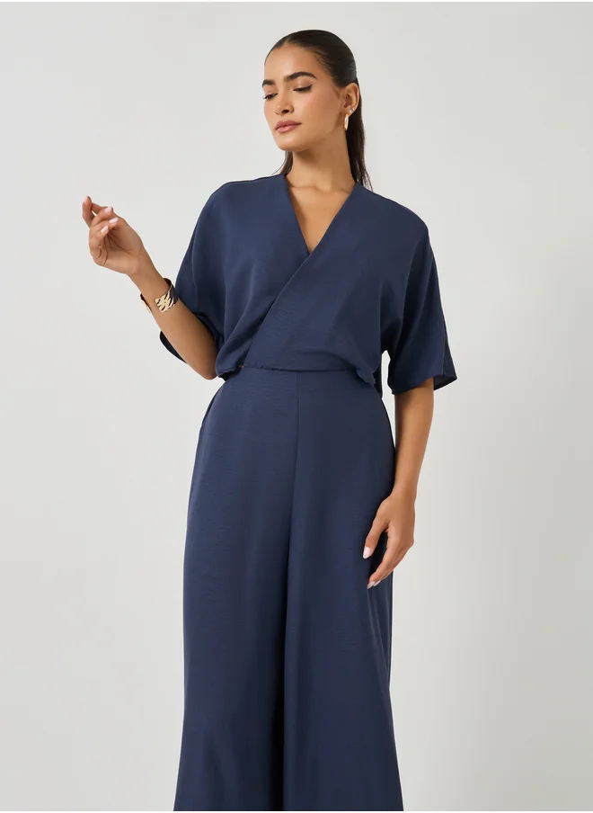 ستايلي Solid Batwing Sleeves Wrap Look Wide Leg Jumpsuit