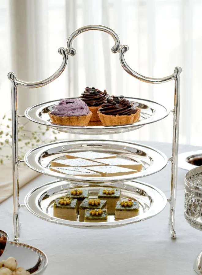 Casa Quesera Add a touch of luxury to your table with this handcrafted 3-tier silver-plated serving platter featuring a solid brass base. Ideal for displaying desserts, snacks, fruits, or appetizers, it’s perfect for high-tea settings, parties, weddings, and festive gatherings. The combination of gleaming  real silver and rich brass offers timeless elegance and lasting durability. A beautiful centerpiece and an excellent gift for weddings, housewarmings, or special occasions.