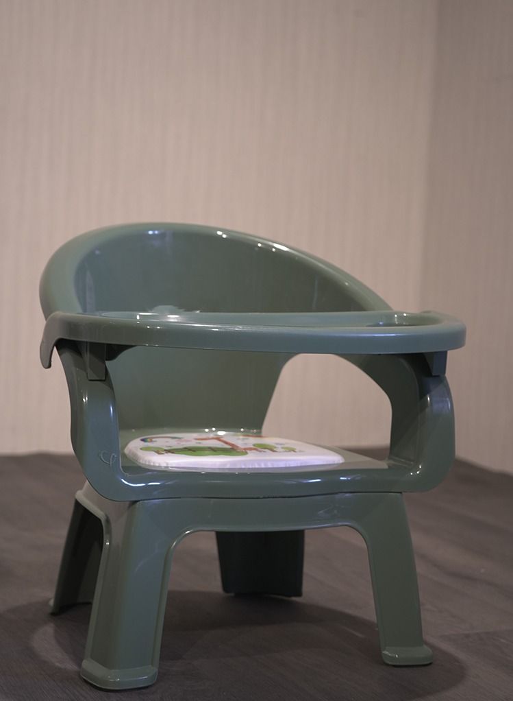A plastic chair for children with a food holder and a place for cups