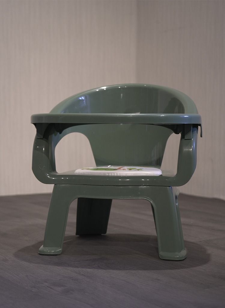 A plastic chair for children with a food holder and a place for cups