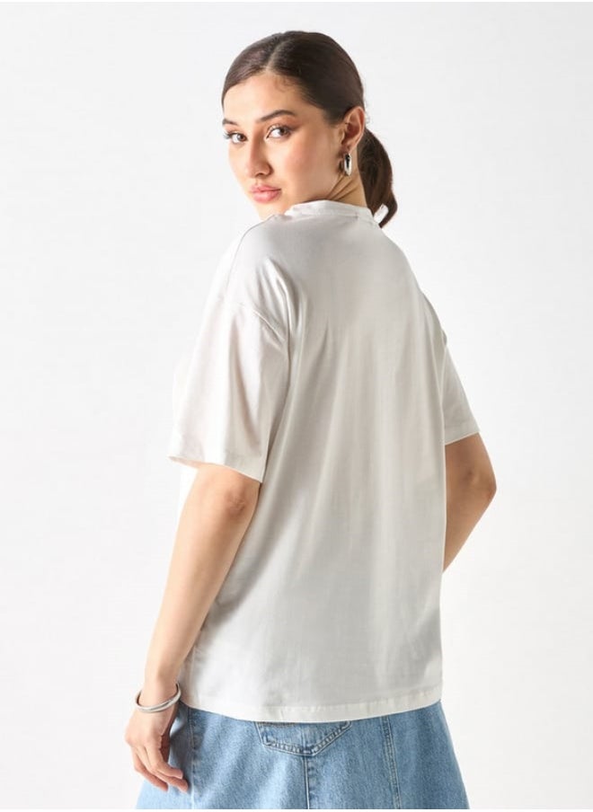 2Xtremz - 2Xtremz Floral Applique Crew Neck Top with Bow Detail - Image 1