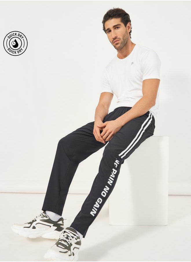 Styli Super Stretch Slogan Print Track Pants  - Image 1