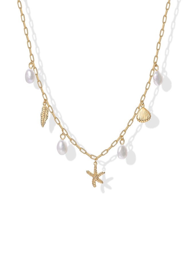 بافوا قلادة PAVOI مطلية بالذهب الأصفر عيار 14 قيراطًا بتصميم شاطئي أنيق للنساء - سلسلة رقيقة على شكل مشبك ورق، قلادة عصرية متعددة التعليقات مستوحاة من الشاطئ - مجوهرات صيفية ذهبية مستوحاة من المحيط مع لؤلؤة المياه العذبة، صدفة بحرية، ونجم البحر - Image 1