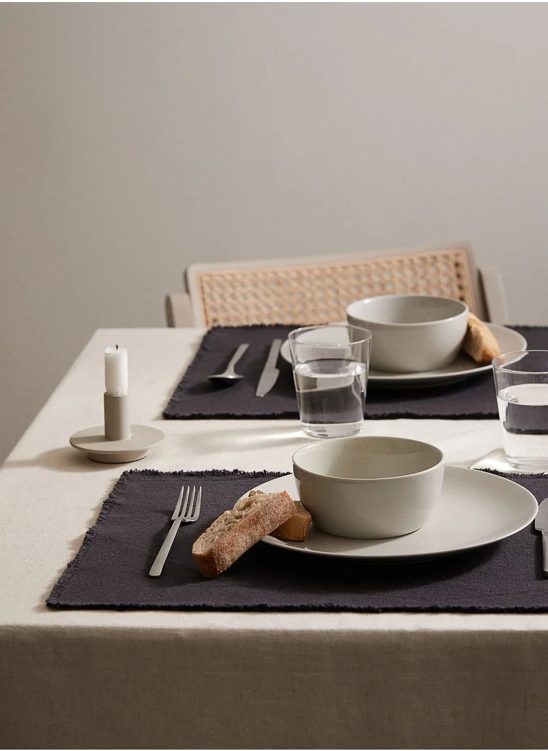 H&M Place mats in washed cotton canvas with frayed edges