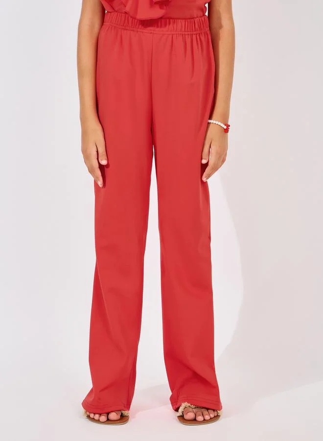 Styli Ruffle Trim Sleeveless Top & Flare Leg Pants Set