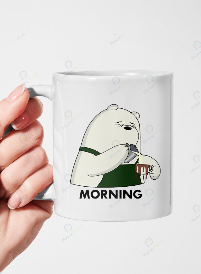 A ceramic mug printed with the phrase Morning and featuring a comfortable handle