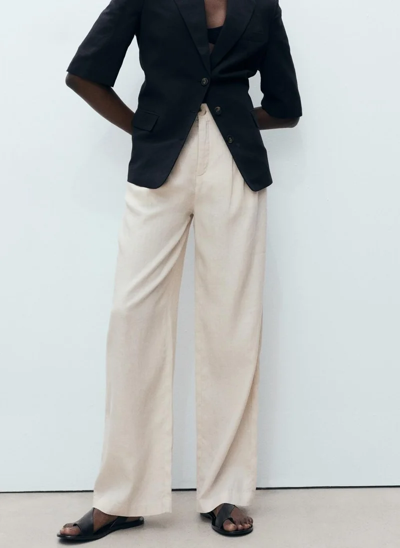 MANGO Linen trousers with tortoiseshell button