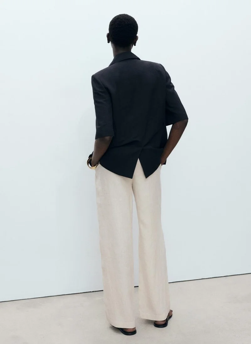 MANGO Linen trousers with tortoiseshell button