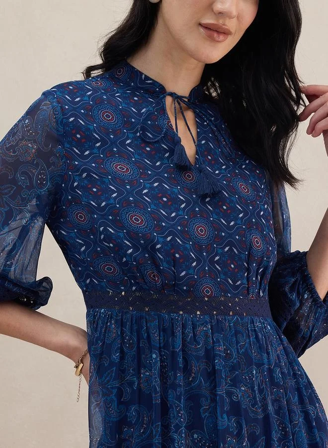 Femmella Paisley Print Tiered Maxi Dress with Tie-Up Neck by Styli