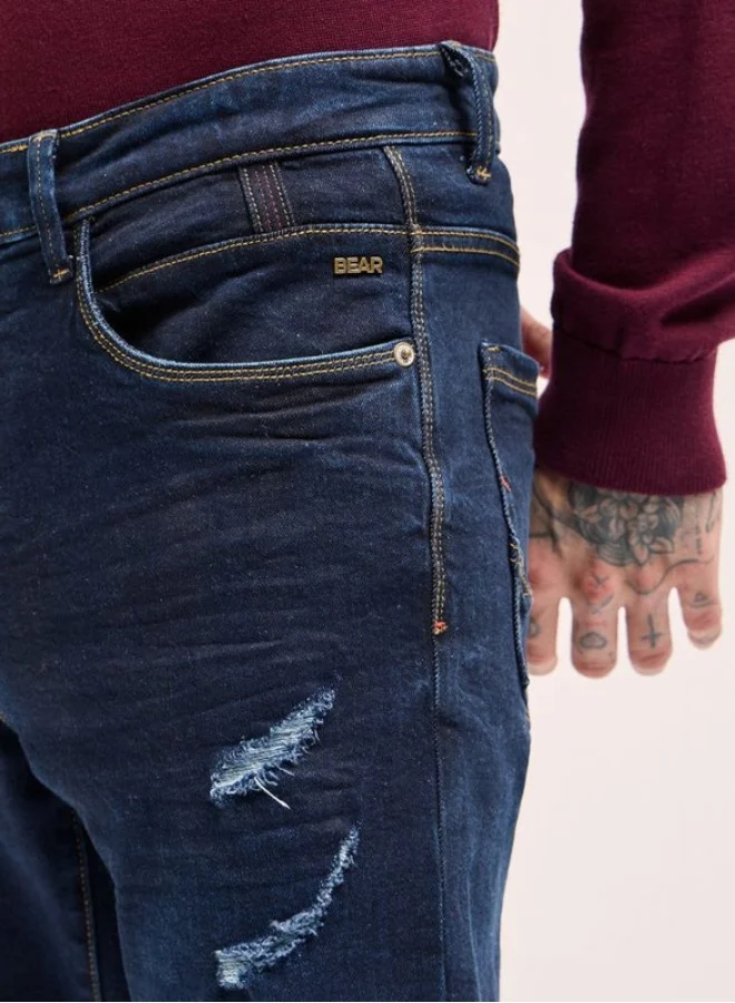 The Bear House  Men's Dark Blue distressing and rip Mid-Rise Slim Fit Jeans Classic Comfort With Modern Style, Perfect For Everyday Casual Looks And Effortless Streetwear Vibes for Men | Best Price UAE