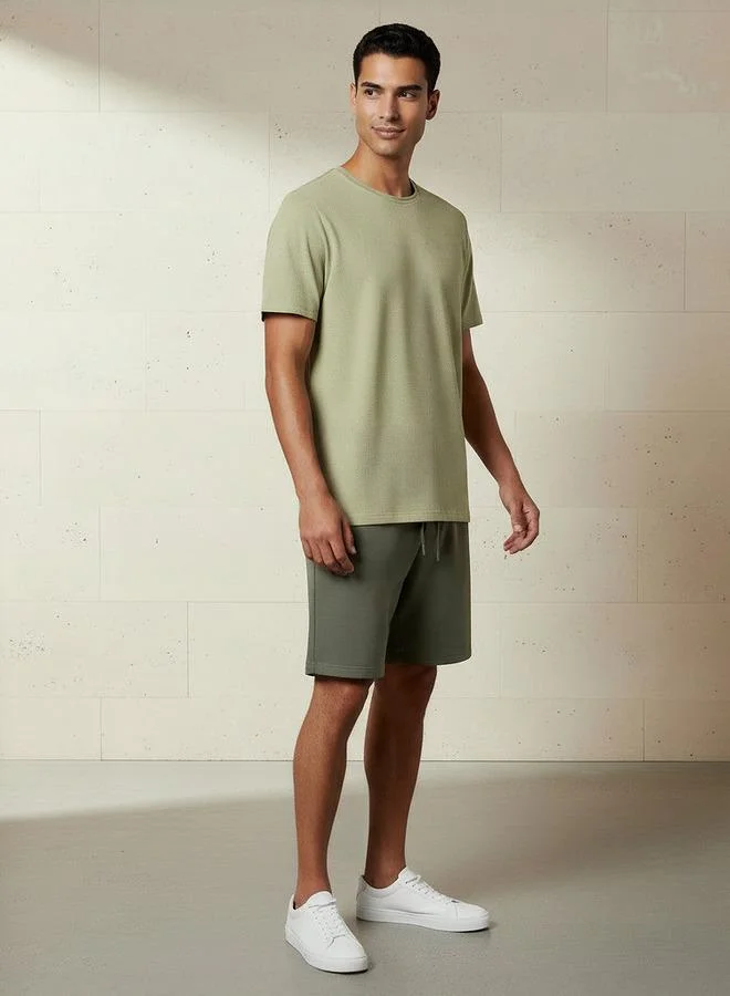 ايكونيك Iconic Men Slim Fit Crew Neck Short Sleeves Popcorn Textured T-shirt