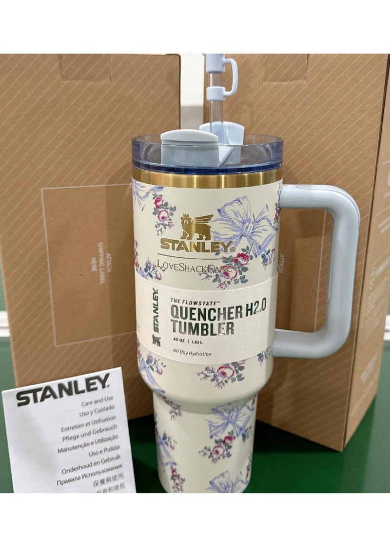 Stanley - Quencher H2.0 FlowState Stainless Steel Vacuum Insulated Tumbler with Lid and Straw for Water, Iced Tea or Coffee, Smoothie and More, 40 oz, Blue bow - Image 1