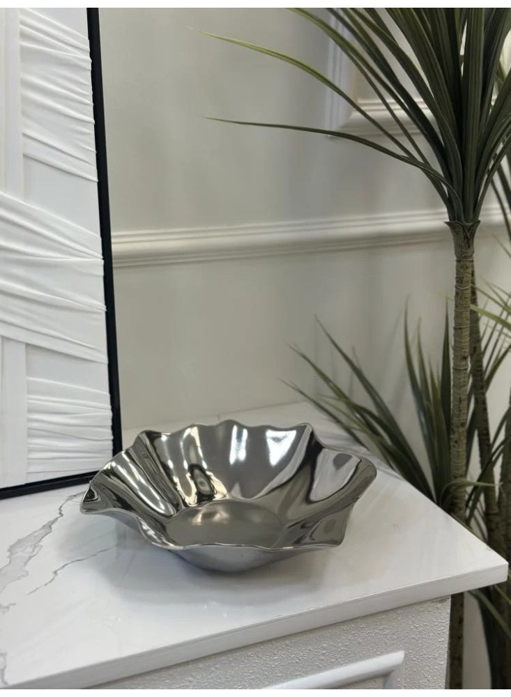 Decorative metal plate with a modern wavy design