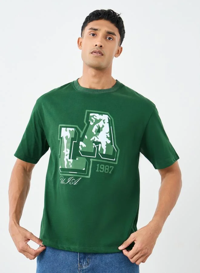 ستايلي تيشيرت فضفاض بياقة دائرية وطبعة جرافيك